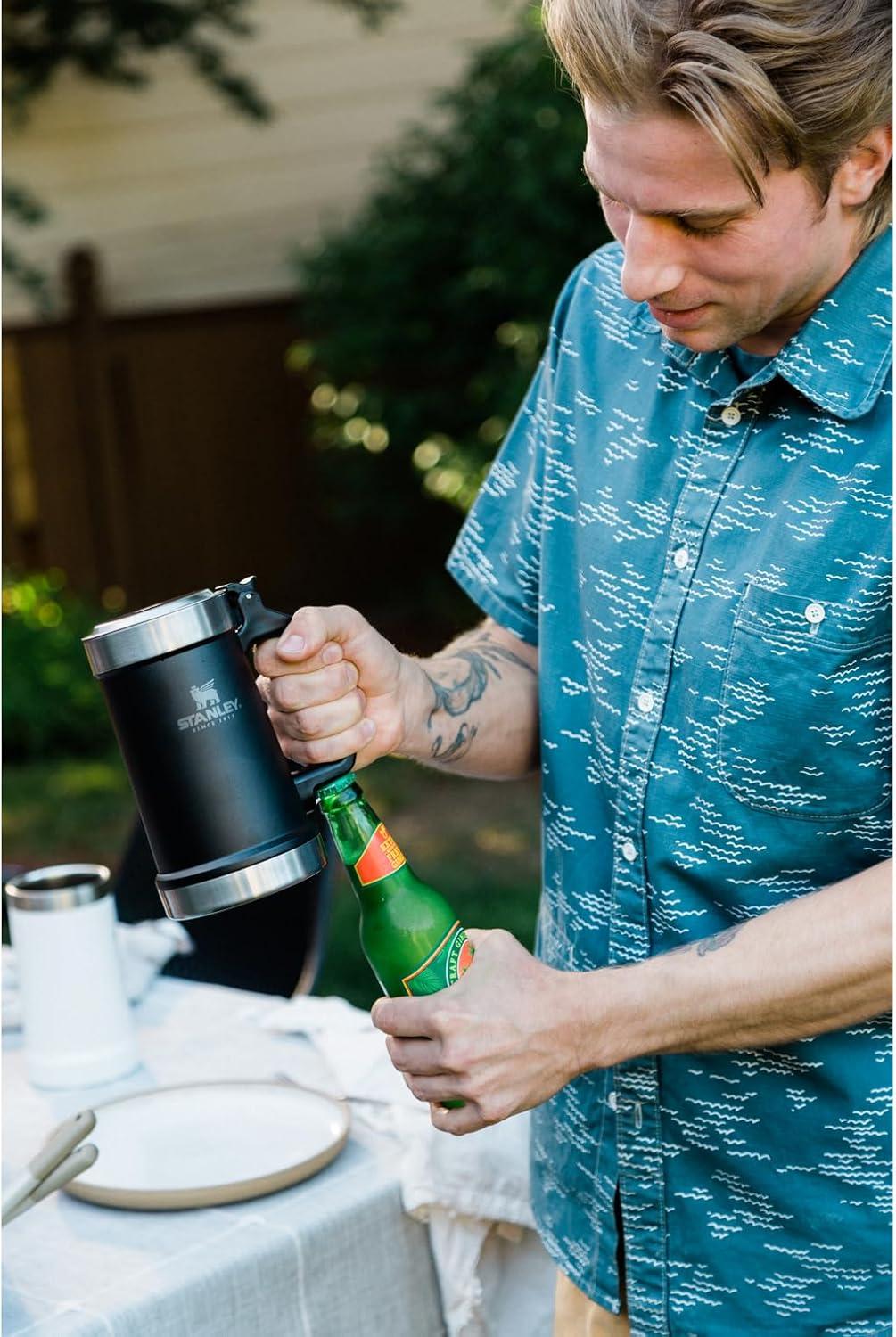 imageSTANLEY Classic Bottle Opener Beer Stein 24 oz Flip Up Lid and Heavy Duty Handle with Built In Bottle Opener Insulated Stainless Steel Beer Mug BPAFree Frost Gloss