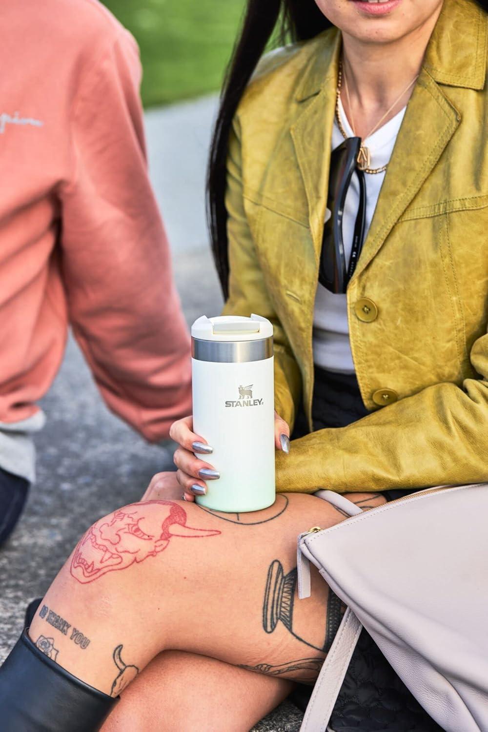 imageStanley AeroLight Transit Bottle 20 oz Locking Drink Through Lid Leak Resistant Water Bottle or Coffee Travel Mug Lightweight Insulated Stainless Steel BPAFree Rose QuartzCream