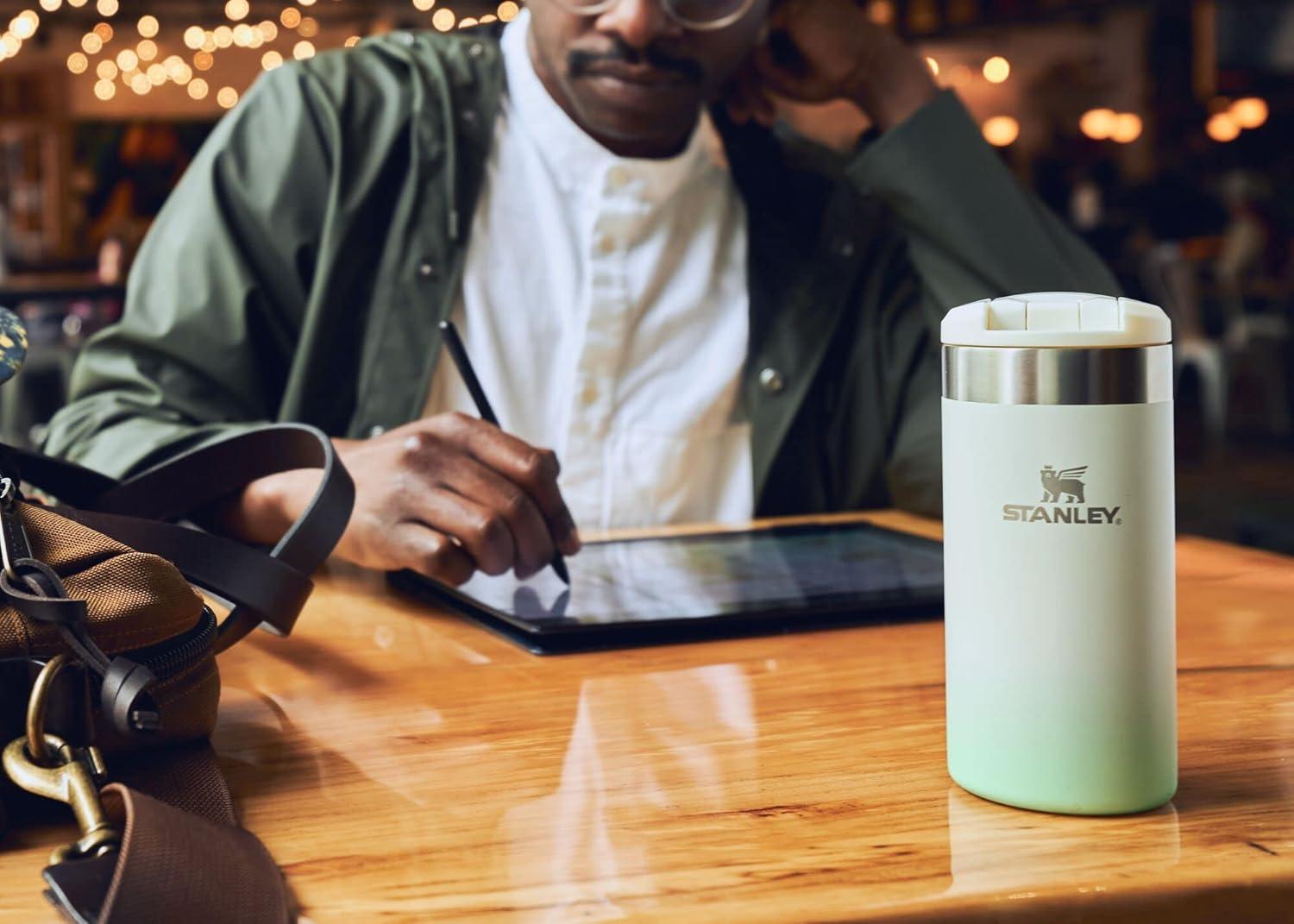 imageStanley AeroLight Transit Bottle 20 oz Locking Drink Through Lid Leak Resistant Water Bottle or Coffee Travel Mug Lightweight Insulated Stainless Steel BPAFree Rose QuartzCream