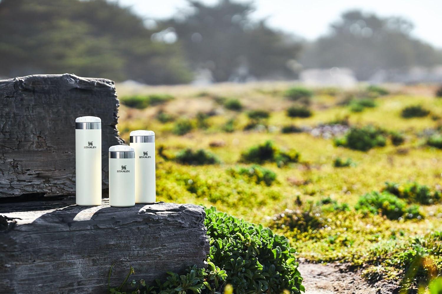 imageStanley AeroLight Transit Bottle 20 oz Locking Drink Through Lid Leak Resistant Water Bottle or Coffee Travel Mug Lightweight Insulated Stainless Steel BPAFree Rose QuartzCream Glimmer