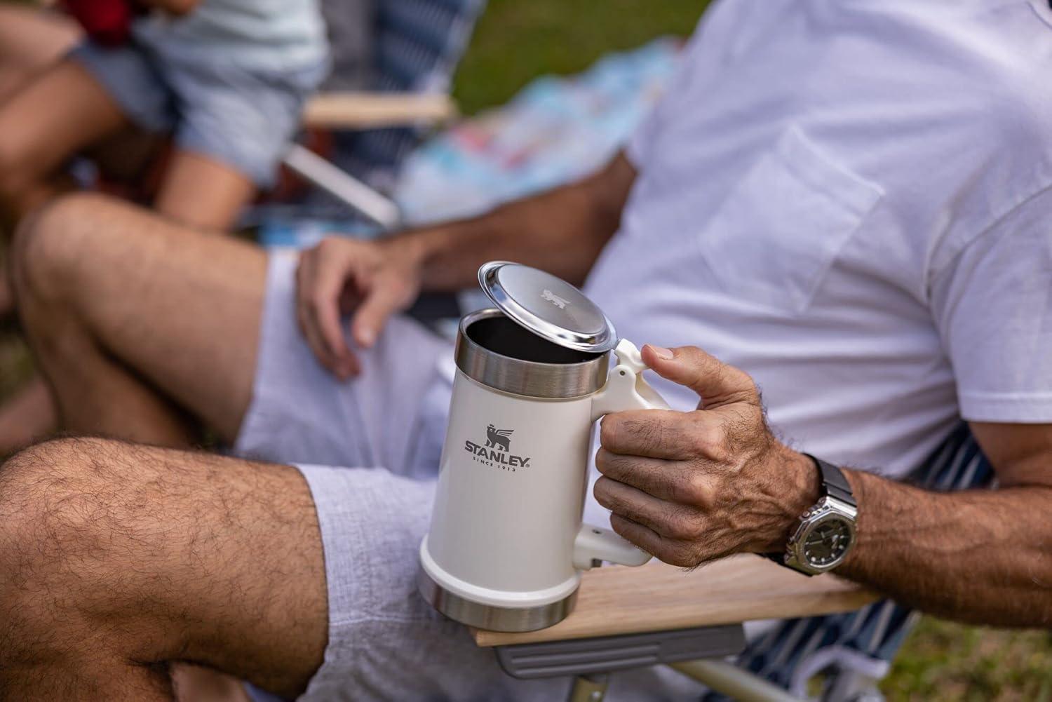 imageSTANLEY Classic Bottle Opener Beer Stein 24 oz Flip Up Lid and Heavy Duty Handle with Built In Bottle Opener Insulated Stainless Steel Beer Mug BPAFree Black 20