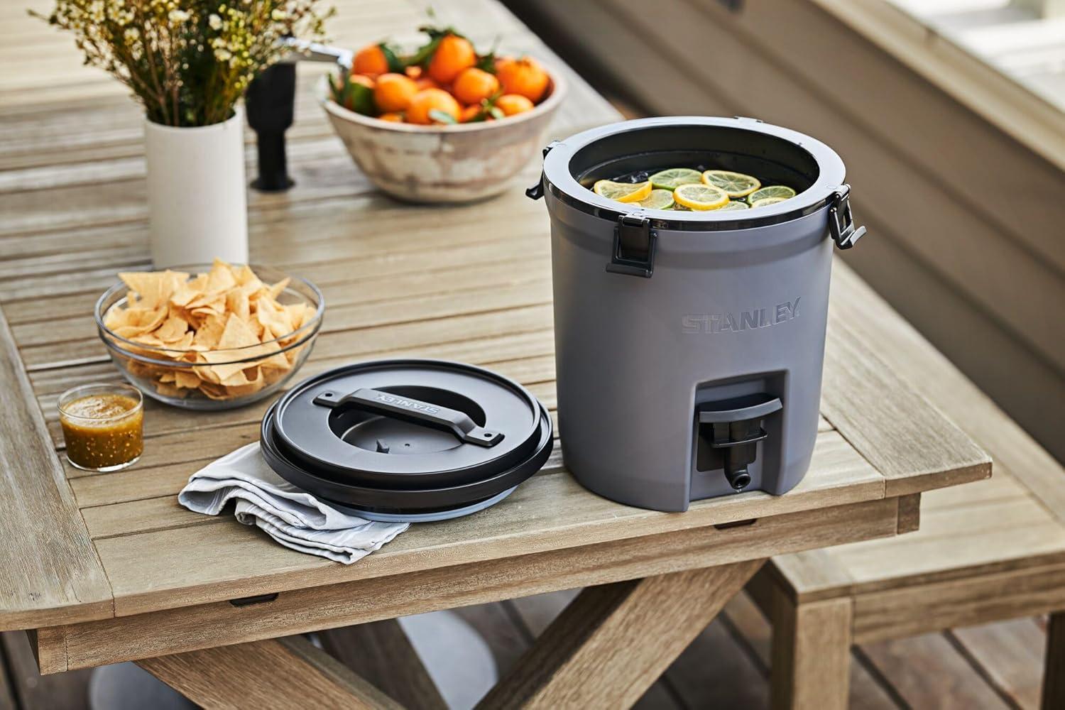 imageStanley Adventure Fast Flow Water Jug 2 Gallon Leakproof Ice Water Dispenser Insulated Beverage Cooler Easy Pour Spigot and Latched Foam Lid BPAFreeCharcoal